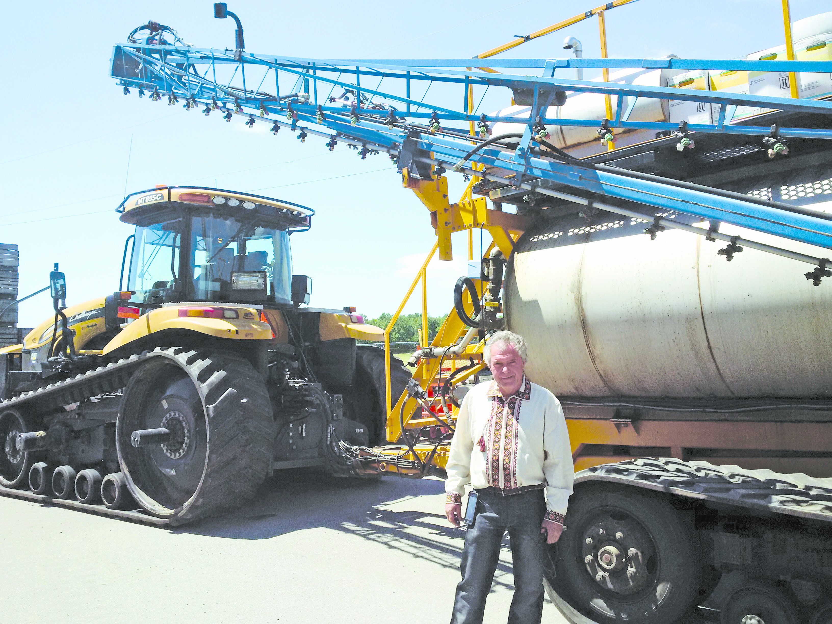 Borys Horodynsky in front of the 3,000-gallon sprayer